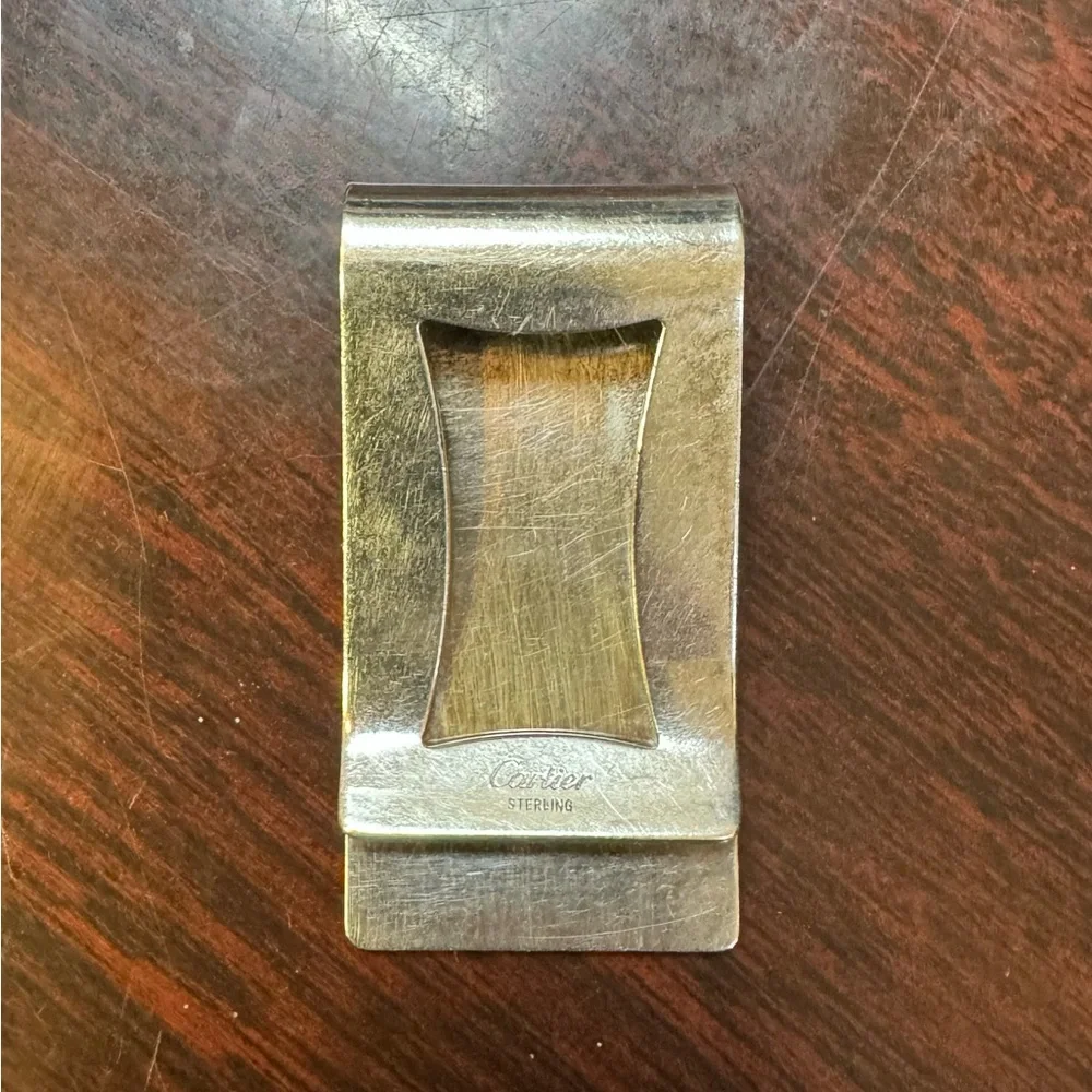 Cartier sterling silver money clip. Engraved with initials DLT.
